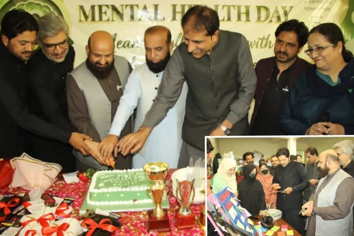 University students present mental health awareness models and educational displays at a World Mental Health Day event in Quetta.